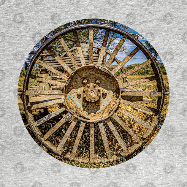 old rusty farm machine wheel in a farm by rickylabellevie